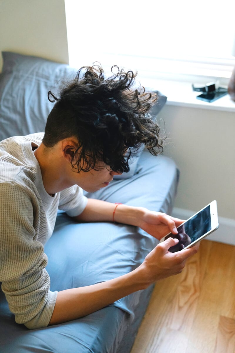 Young guy texting on mobile phone